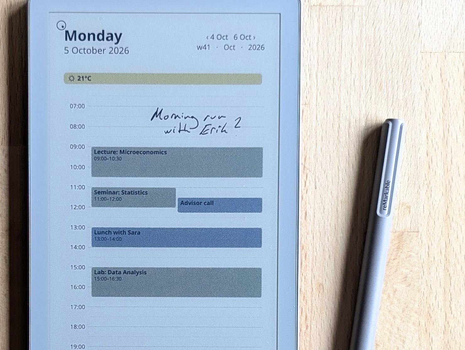 Close-up of handwriting and colour-coded events on the e-ink planner
